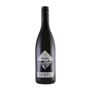 Merlot Exklusiv 2024 im Weinglas, tiefdunkelrot mit schwarzem Kern, kräftiger Rotwein mit samtigen Tanninen